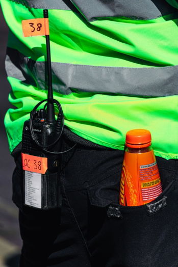 orange-and-black-bottle-on-black-and-green-bag.jpg orange and black bottle on black and green bag