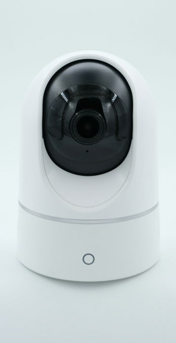 a-white-camera-on-a-white-surface.jpg a white camera on a white surface